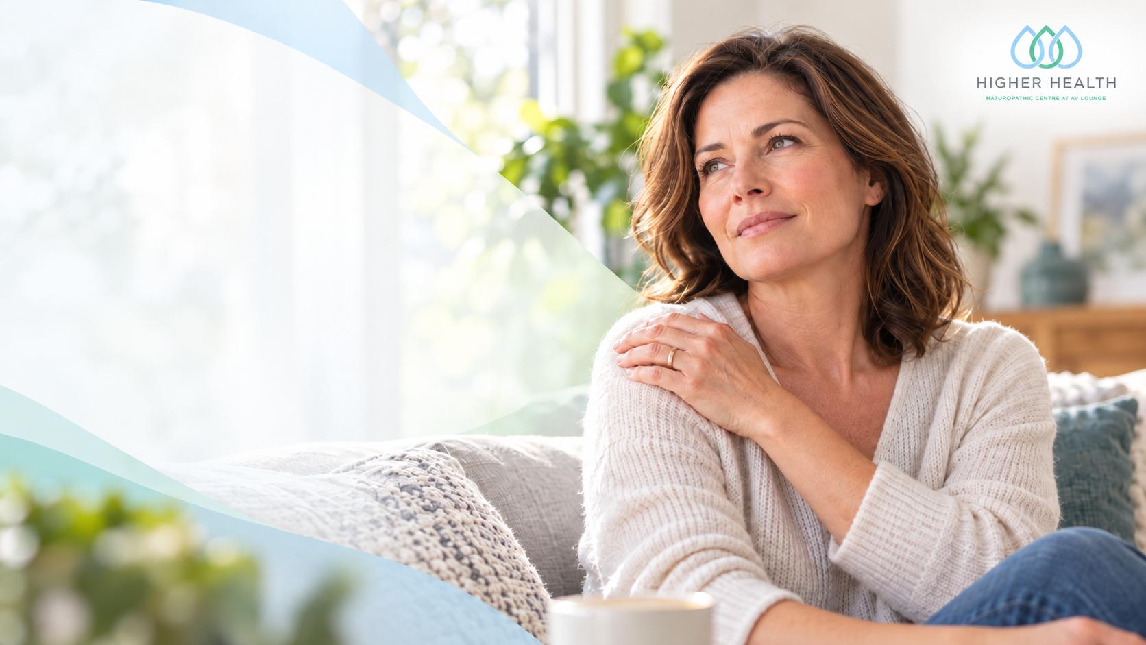 Woman with perimenopause joint pain holding her shoulder